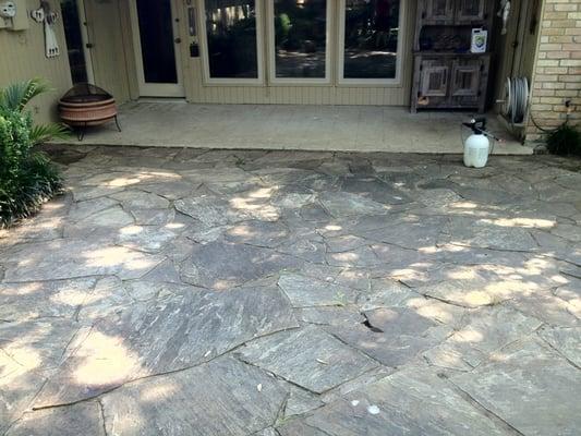 Before photo of flagstone surface soft wash cleaning