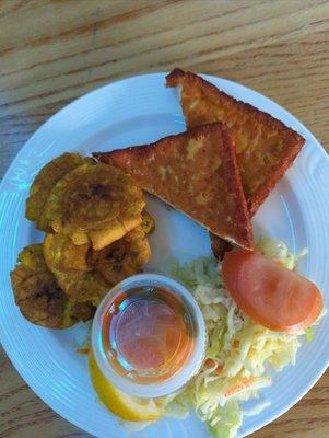 Fried plantains with fried cheese and a salad