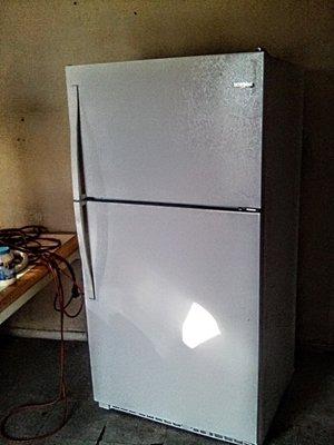 This is my brand new 20.5 cubic feet refrigerator freezer it's a whirlpool and I love it but all they have to do and go buy groceries