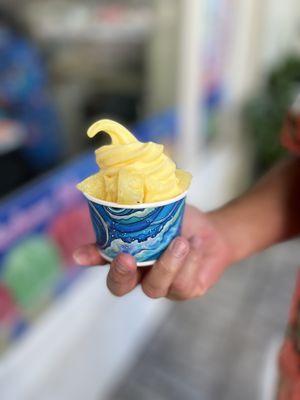 Pineapple soft served ice cream with pineapple chunks