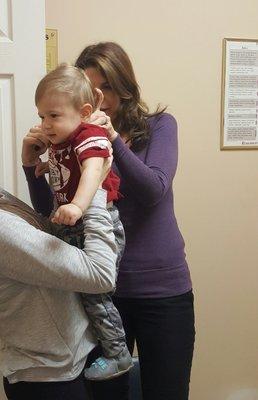 Dr. Julie Syat taking care of toddler patient.