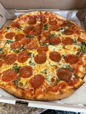 Pepperoni and spinach medium pizza.