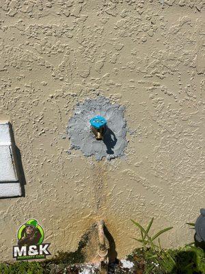 After Hose spigot replacement, Repiping and stucco repair. (No texture or painting requested.)