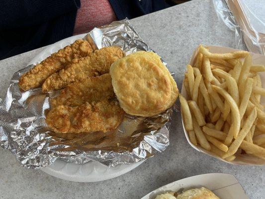 Chicken strip plate with mac-n-cheese and fries.