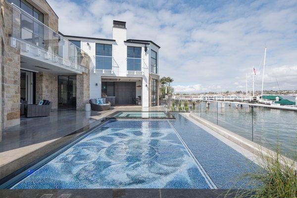 Mosaic Pool floor that can vary its level from swim pool, lounge shelf to deck