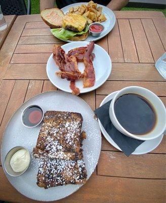 French toast, coffee, side note plate of bacon, smash burger