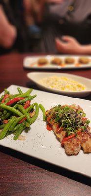 Almond crusted mahi with green beans and creamy corn/risotto mixture.