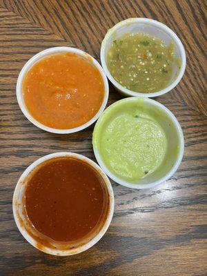 Their 4 salsas - all delicious! (Orange one is SPICY!)