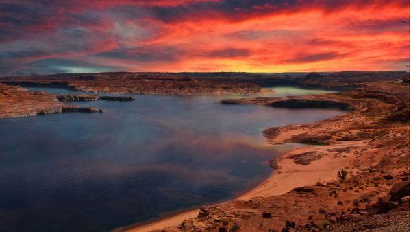 Sunset at Lake Powell: Nature's hues weave magic over the tranquil waters.