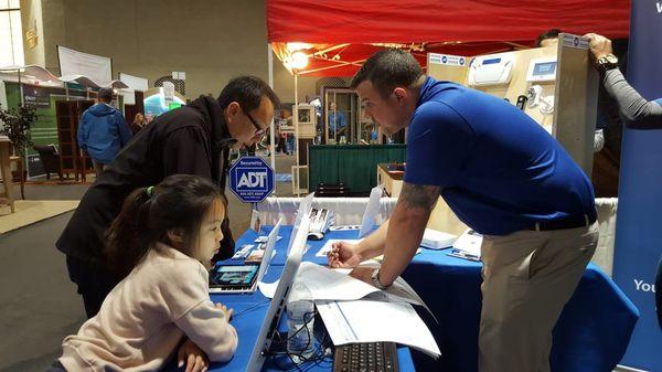 Bryan at local home show helping out a customer.