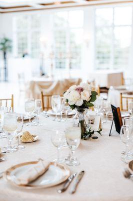 Reception table greenery (re-used bridal bouquet) with vases from Catherine's Garden