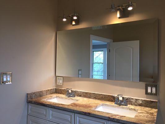 Vanity mirror with a wide beveled edge