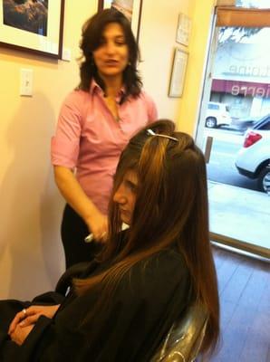 Having a good time cutting, coloring and styling hair!