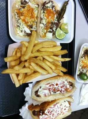 Tacos fries and hot dogs.