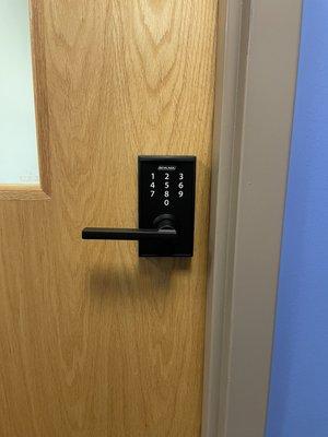 Commercial Schlage lever keypad lock, made for an office, storage roo, or any room that needs more privacy than security.