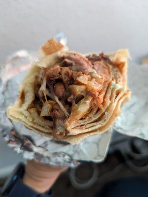 California birria burrito with vegan birria and dairy cheese