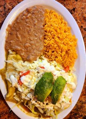 Enchiladas rojas y verdes con pollo - What a treat! Loved the house made salsa, cheese, crema, and fresh veggies on top. :)