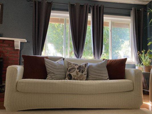 Cream couch cover & grey black out curtains.  Love them!