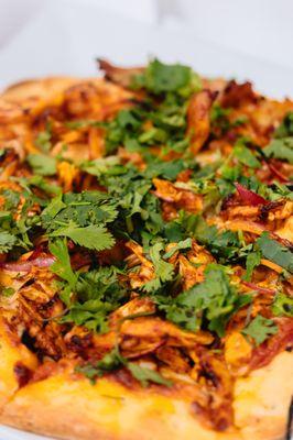 Tandoori Chicken Pizza
Shredded chicken, cilantro and onions marinated in tandoori masala.