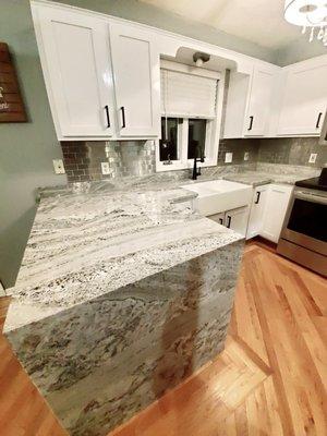 Love my new granite countertops, especially the waterfall!