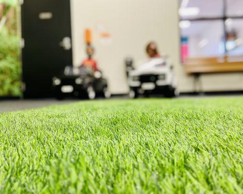 The first play area when you walk in is like a camp ground with a green grass looking carpet. Awesome!