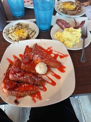 Strawberry French toast, cheese hash browns, turkey bacon and eggs