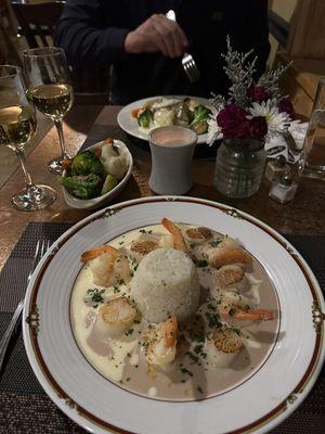 Shrimp and scallop with beurre blanc and beurre rouge sauce at front; Pan seared flounder in back