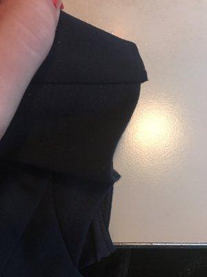 The edge of my dresses sleeve: not lined up, careless, a disgusting job.