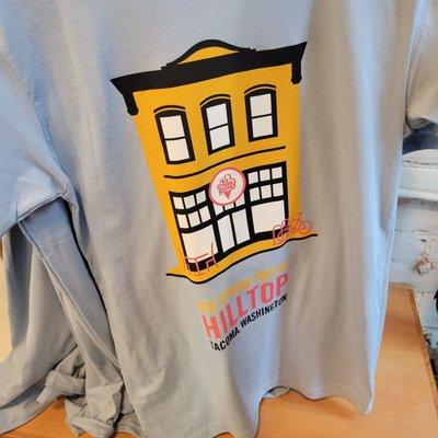 Each location (there are three) has a distinctive neighborhood logo shirt for where it's located in town.