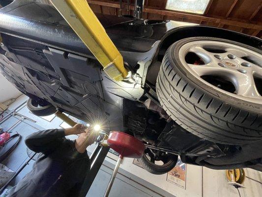 Ruben diagnosing the car while changing oil.