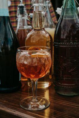 Our Aperol Spritz, a beloved classic, is a featured favorite on our menu--refreshing, vibrant, and perfect for any occasion!