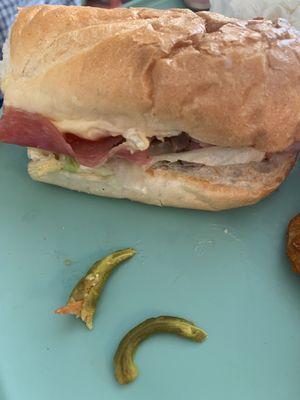 Large Sharp pepper stems inside loaded Italian Sub! The inside of the stem felt like it had a sharp wire inside of it. It cut my tongue!