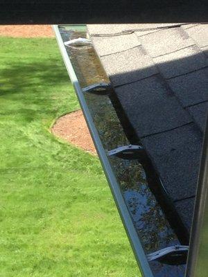 clogged downspouts stop water from flowing.  This water freezes and help to pull gutters away from your house....  We can help !