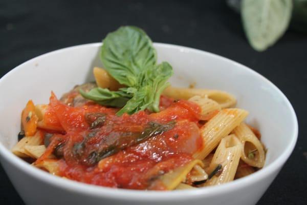 Penne Pasta with wood fired roasted veggies and our imported tomato special red sauce