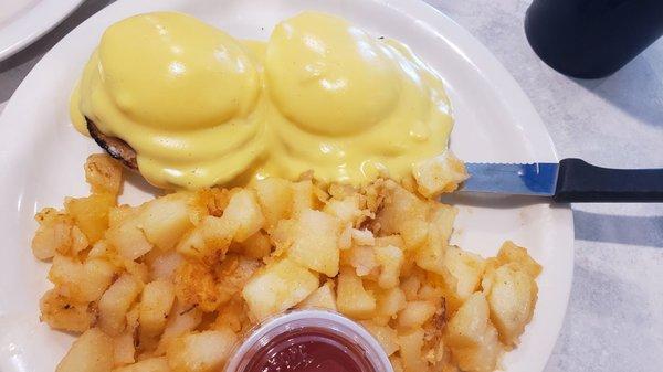 Eggs Benedict and home fries.