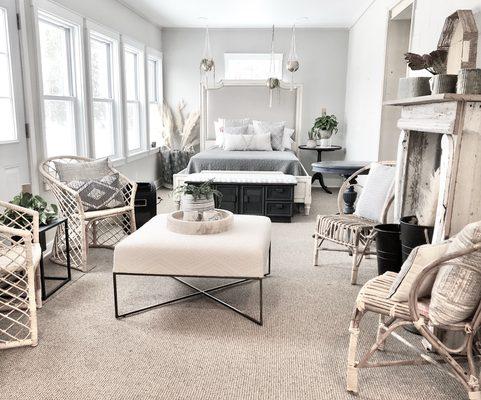 Selection of decor, salvaged mantle, chairs and bed.