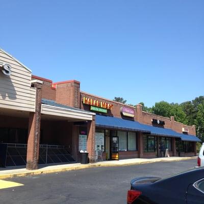 Small shop with a huge parking lot.