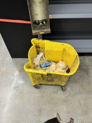 dirty mop bin. literally soo gross bugs flying in and out of it. just sitting in the middle of the store