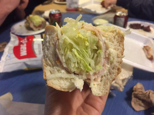 A turkey sub with far more lettuce than turkey