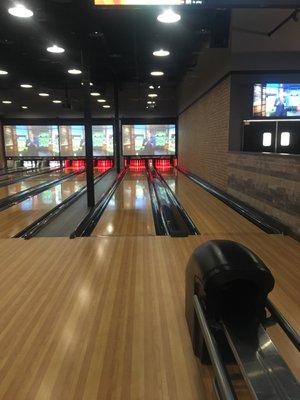 Watching the game while bowling!