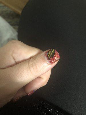 Deep French tip with fall glitter leaf on thumbnail