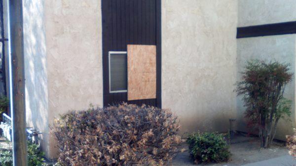 Broken window from a break-in. This is one of those dark spots in the complex so several units in this location were robed.