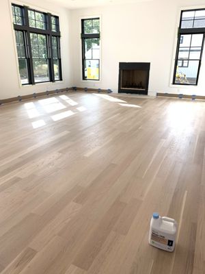 silver gray stain on white oak engineered floors, bona mega finish applied