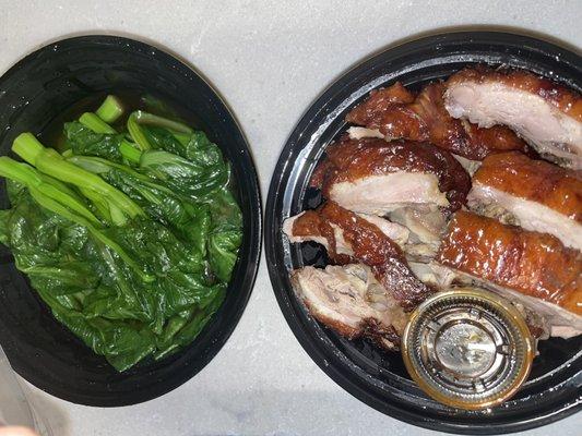 Steamed Seasonal Vegetables with Oyster Sauce is in a larger container than roast duck.