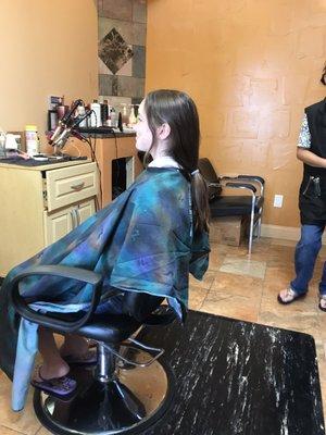 My daughter wanted to cut her long hair into a pixie cut.