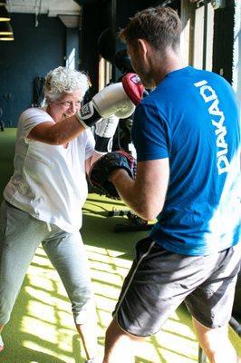 Elizabeth showing her trainer Gavin how she truly KICKS ASS!