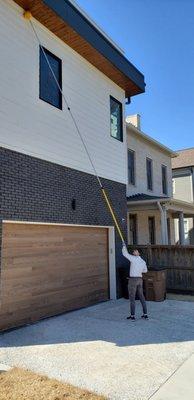 We don't only brush your upper eaves to remove spider webs, wasps nests, and mud daubers but we also treat those areas to prevent built up.