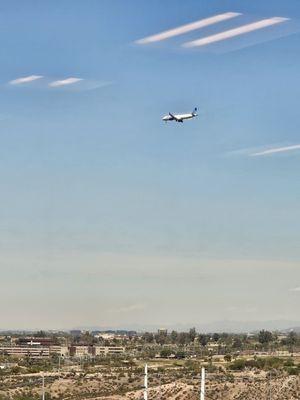 Plane flying over Marina Heights