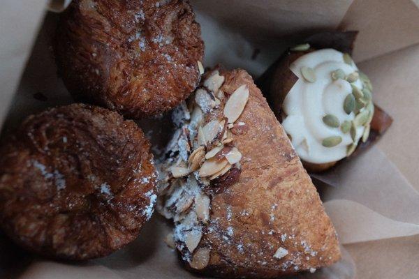 Kouign Amann, almond bostock, Pumpkin cupcake