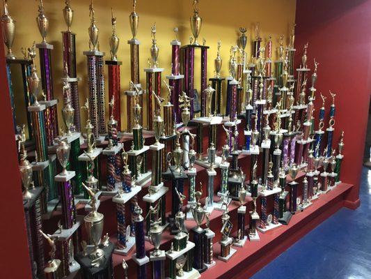 The trophies here are just a part of what they've won. They're dedication are their students.